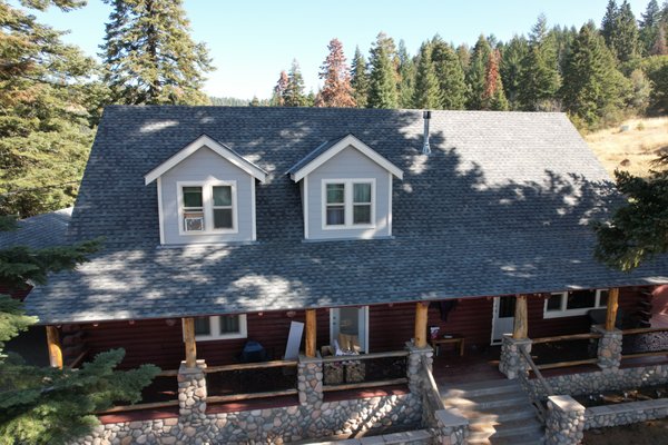 we installed a 30 year Pabco Premier Pewtar Grey roof. We love how the style matches the stone siding.