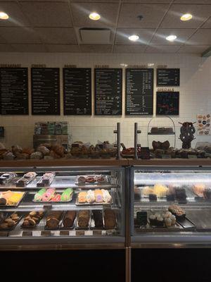 bakery counter, plus menus in the background