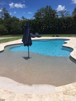 New swimming pool with a beautiful beach entry.