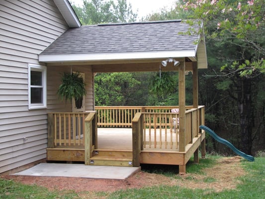 added new covered porch to this house with a slide off of deck.