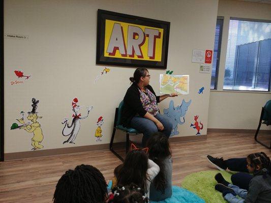 One of the lovely staff members reading to the children