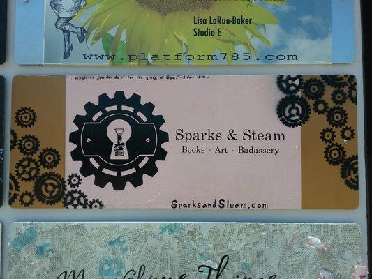 Sparks & Steam's sign, located on the outside of the shop building.