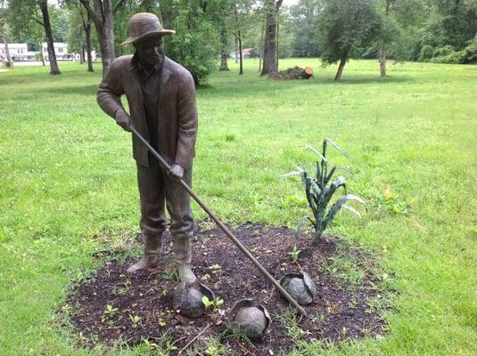 Life-like bronze figures depicting their daily life