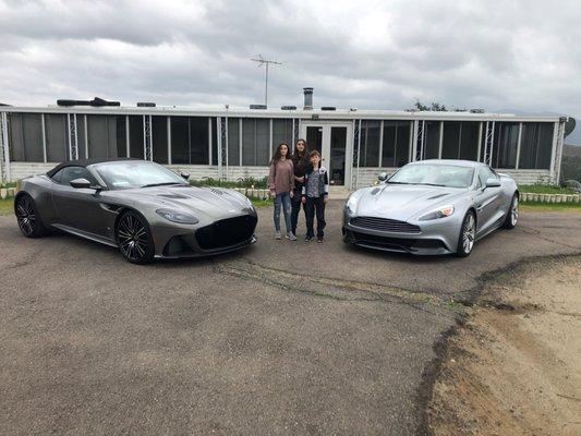 My cars from Aston Martin San Diego in front of the cabin and kids.