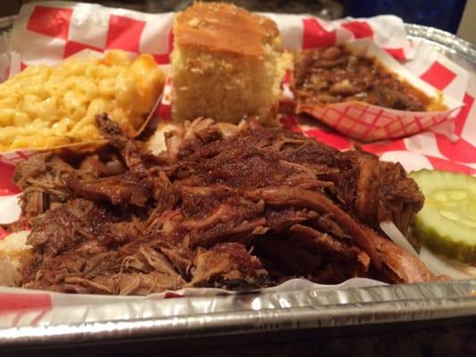 Pulled pork platter with cornbread, mac n cheese, and beans