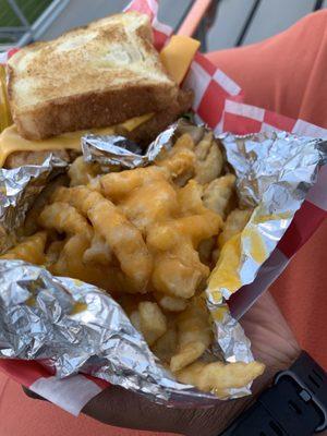 Cheese fries and chicken club sandwich