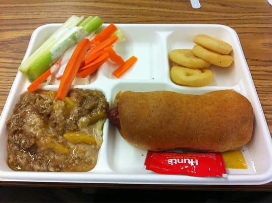 Hot Dog on Whole Wheat Bun, Potato Smiles, Apple Crisp, Carrots & Celery.