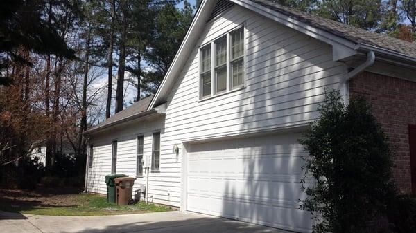 Driveway side of home prior to new siding