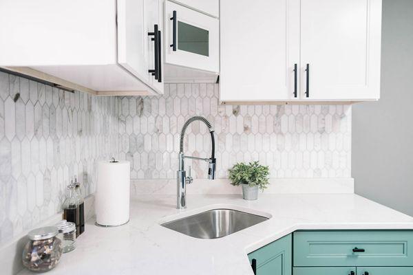 Green Cabinets and Marble Tile Backsplash