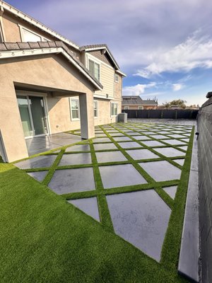 DIAMOND CONCRETE PADS W/TURF IN BETWEEN & PATIO CONCRETE UPGRADED