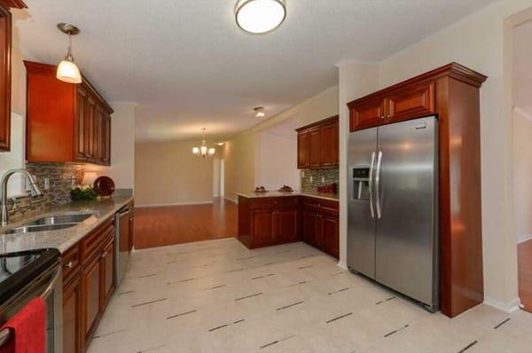 Cherry Cabinets and Desert Gold Granite by Global Home Decor.