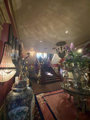 The grand staircase with a sampling of elegant antiques