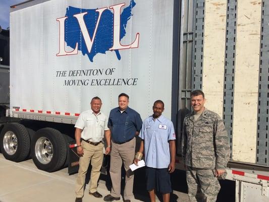 Pictured in front of the Lippincott Van Line truck left to right: Mr.Honolito Directo 99th LRS Logistics' Manager, Mr...