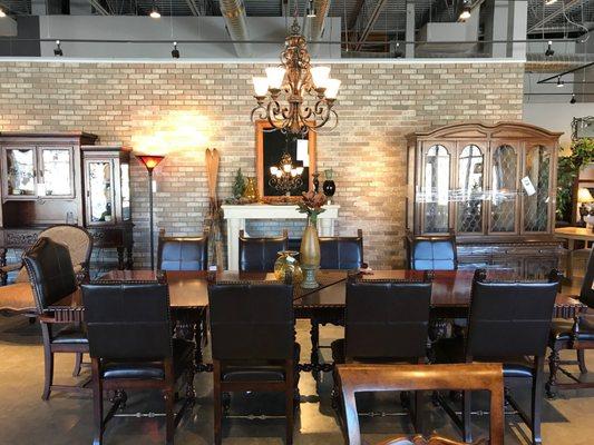 Interior shot of our floating brick wall and a very large dining table.