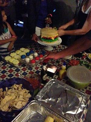 A cake made to look like a burger, cupcakes that look like corn on the cob, and some red/white/blue cupcakes (4th of July!)