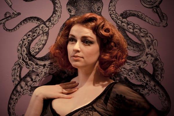 Vintage style Portrait in front of the octopus in the reception area of Emerson Salon