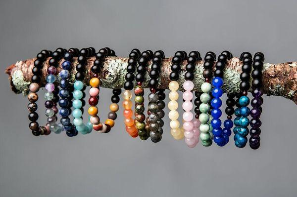 Stacked with Intention-stacking bracelets with affirmation beads.