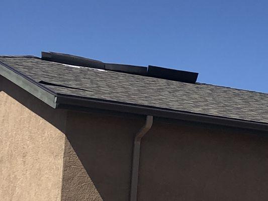 Saint-Gobain CertainTeed shingles flapping in the wind over our garage.