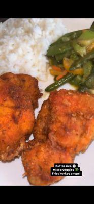 Butter rice, mixed vegetables, fried turkey chops