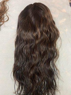 A beautiful naturally highlighted blend of browns with a natural wave