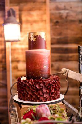 Burgundy Watercolor wedding cake with Gold leaf Accents  Photo Credit:  Jeannine Marie Photography