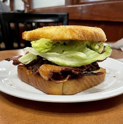 BLT made with lots of crispy bacon, lettuce, and toast. No sliced tomatoes though.