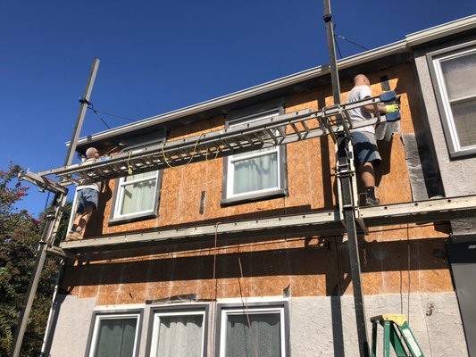 Stucco remediation in progress.