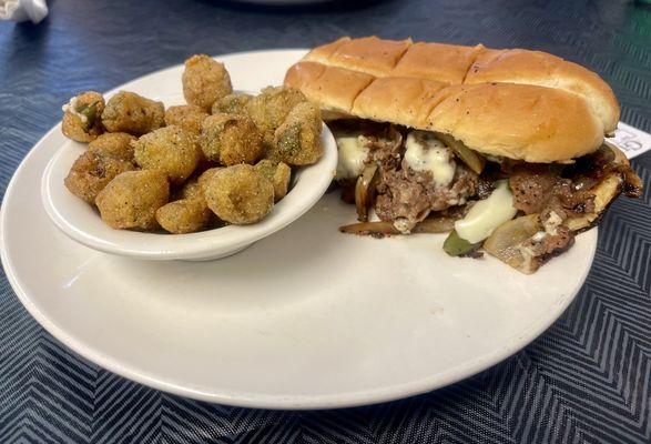 Philley Steak and cheese sandwich with a side of okra