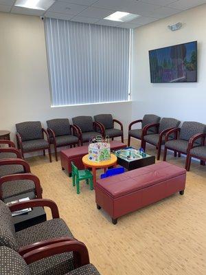 waiting room area, set up with a play center.