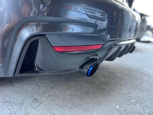 Carbon fiber rear diffuser and matching tail pipes..