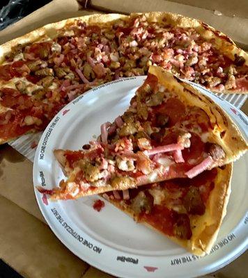 Meat Lover's Pizza thin and crispy with extra bacon and extra pepperoni.