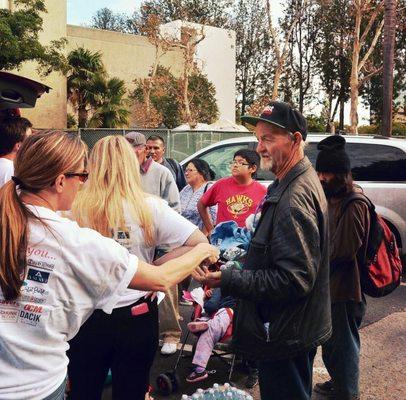 Burritos, bottles of water, goodie bags with toiletries & snacks, and clothing & shoes for Orange County's homeless