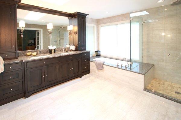 Spacious master bath vanity, shower, and tub area.