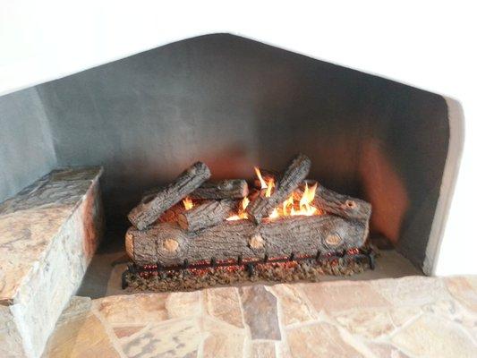 Firebox plastered with high temp plaster and new gas logs