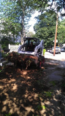 The owner hard at work replacing a families lawn.