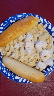 Chicken Alfredo comes with bread sticks.