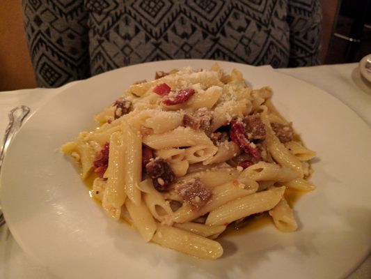 Sausage with artichokes and sun-dried tomatoes.