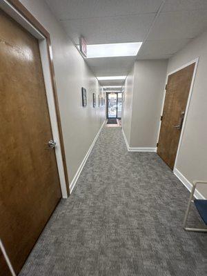 Hallway from the top of the steps of the bookstore, looking to the outside