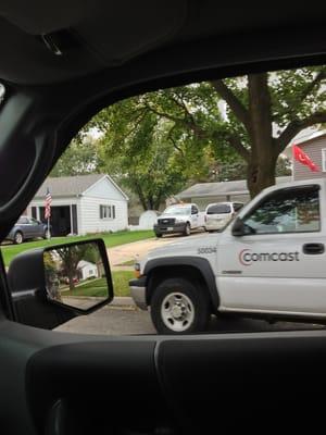 Define irony. A comcast truck in front if a house with a comcast truck in the driveway!