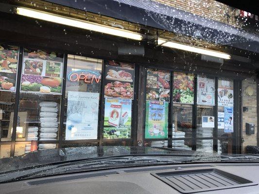 Front windows of the store. If passing at night Silver grates Cover the windows