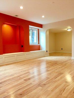 Finished basement in Novi. Built-in window seating with archway display area.