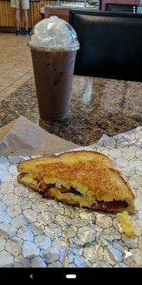 Had the breakfast panini and an Almond Joy flavored iced latte. The breakfast panini was perfect. Delicious eggs, bacon, and cheddar cheese.