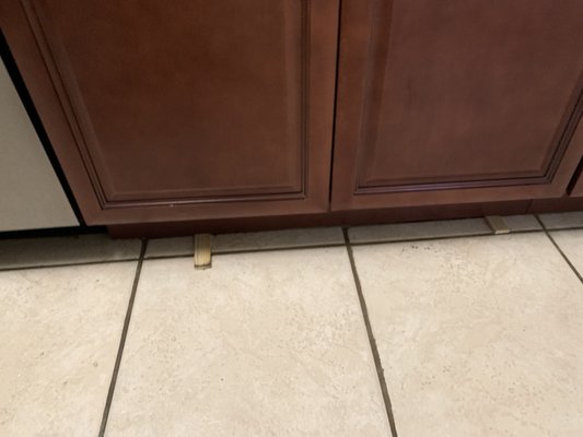 Left wooden planks under the counters because they were uneven