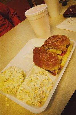 Grilled chicken sandwich w/ cole slaw and potato salad and pink lemonade