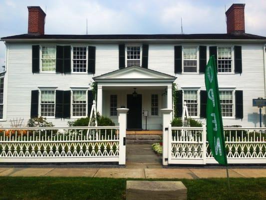 The front of the Kent-Delord House Museum with an excellent view of the garden