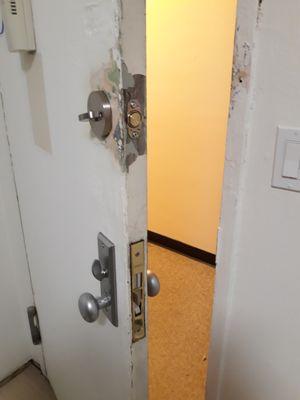 They were able to modify the metal door to fit the lock in. It will look better once painted white.