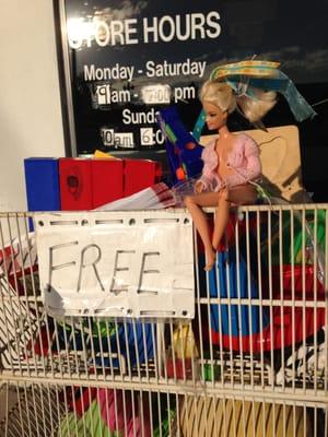 Shelf of free toys out front