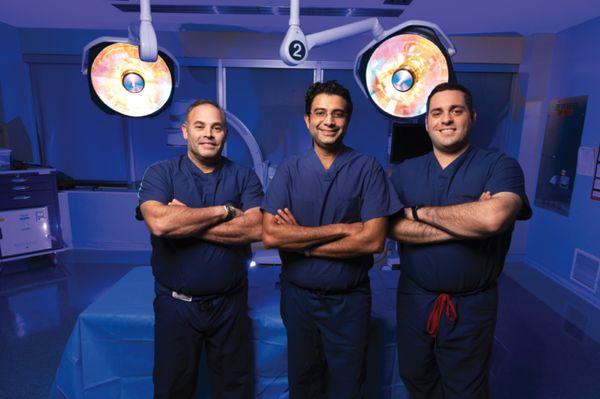 Dr. David Wells-Roth, Dr. Harshpal Singh, Dr. Aaron J. Greenberg in operating room