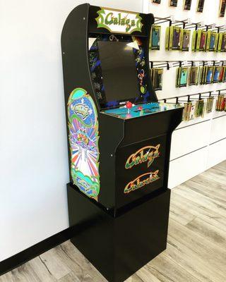 Our new Galaga Arcade1Up cabinet with custom built riser for our store!