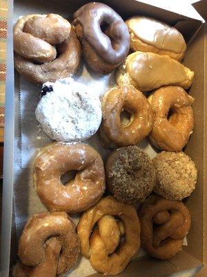 Bakers Dozen $9.75 Glazed, cinnamon twist, chocolate cake, maple crumb cake, maple cream sticks, powdered black raspberry jelly.